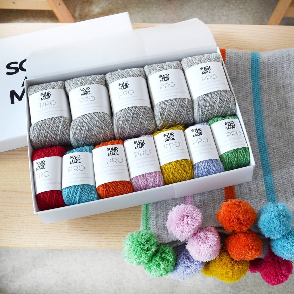 https://images-stylist.s3-eu-west-1.amazonaws.com/app/uploads/2020/03/29153913/original_pom-pom-stripe-crochet-blanket-kit.jpg