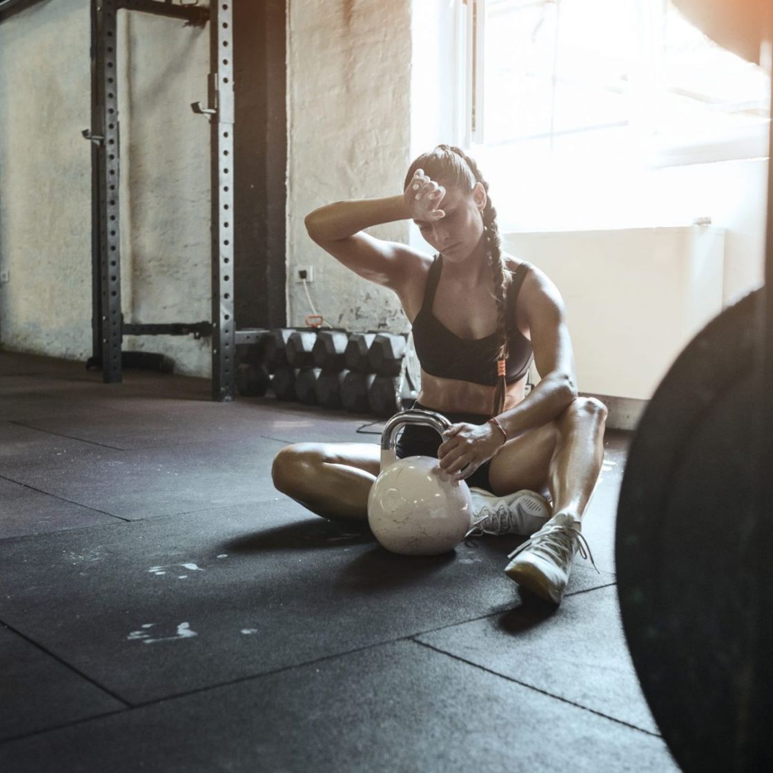 Fit Young Woman Sweating during a Gym Workout with Rings Stock