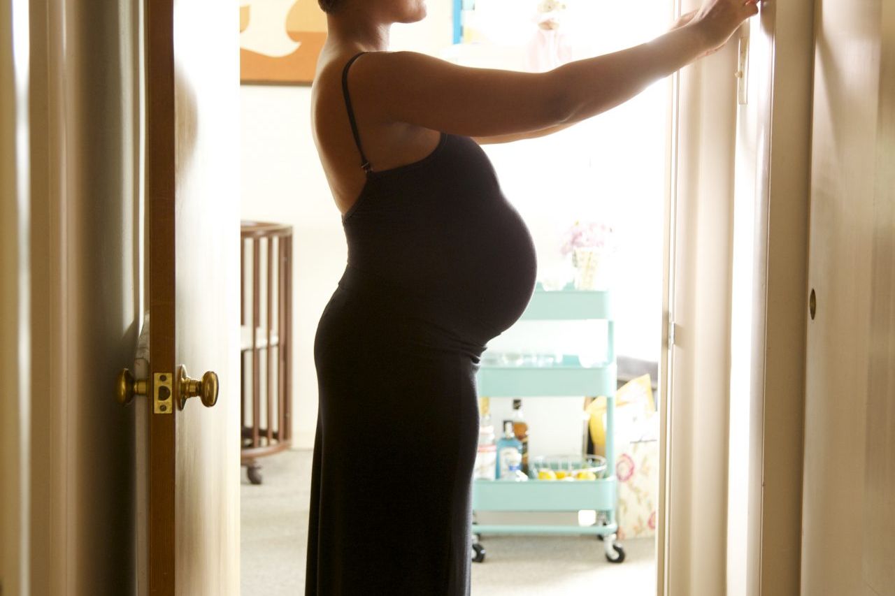 A Pregnant Woman Has Nothing To Wear. a Pregnant Woman Stands in Front of a  Closet with Clothes and Does Not Know What Stock Image - Image of finding,  fabric: 275487169