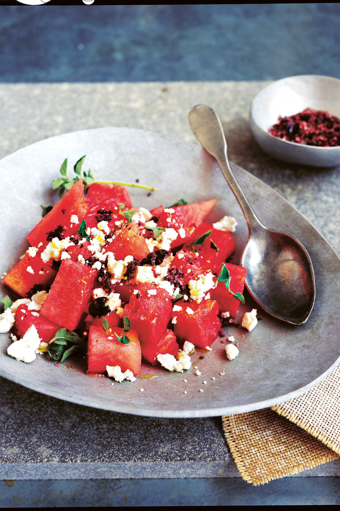 https://images-stylist.s3-eu-west-1.amazonaws.com/app/uploads/2021/07/15173815/watermelon-and-ricotta-salata-salad-with-olive-salt-1120x1680.png