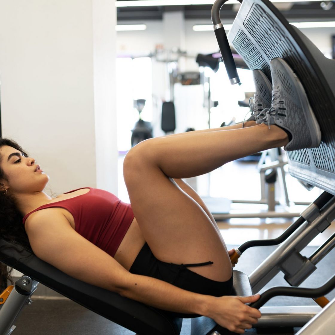 How to set up and use a lying leg press in a lower body workout