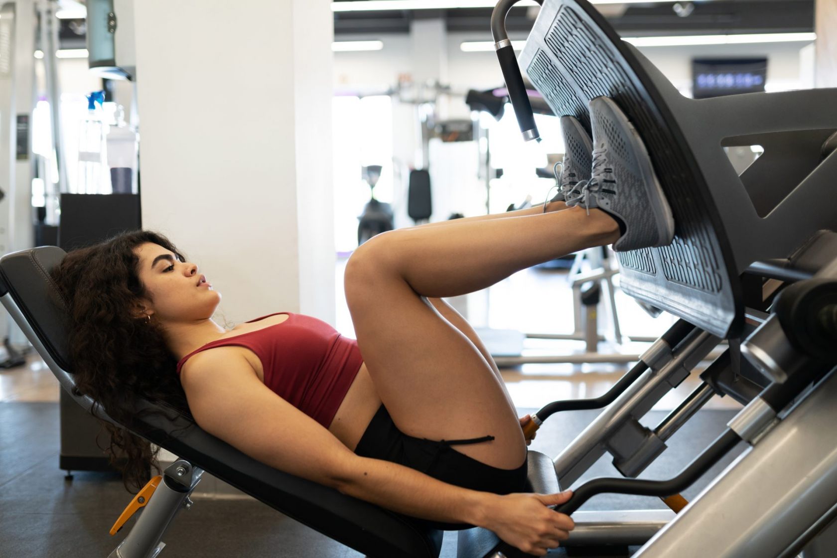 How to set up and use a lying leg press in a lower body workout