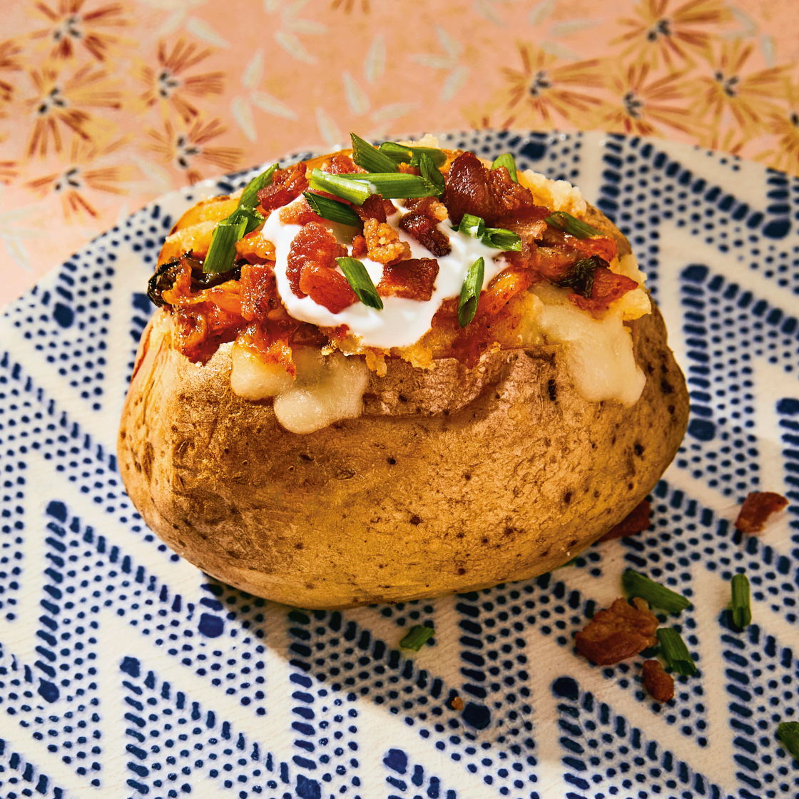 https://images-stylist.s3-eu-west-1.amazonaws.com/app/uploads/2022/03/29140439/kimchi-baked-potato-1120x1120.png