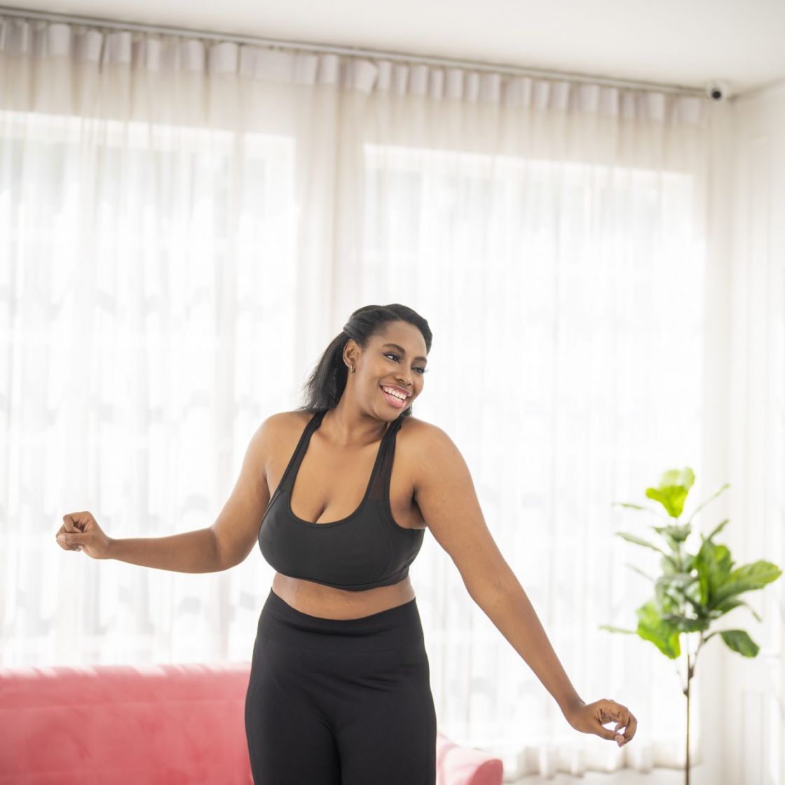 Woman Plus Size in Gym Doing Exercises with Running Training App